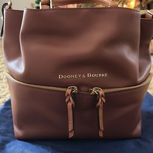 Dooney & Bourke never been used, tags on, beautiful brown purse.